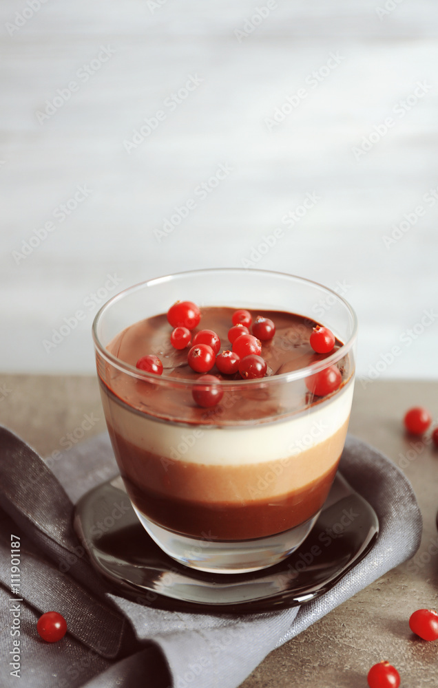 Delicious dessert with rowan in glass on table Delicious dessert with rowan in glass on table