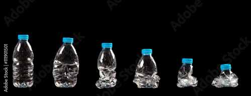 different steps of compressing a plastic bottle isolated on black background