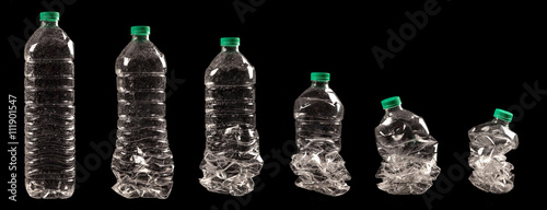 different steps of compressing a plastic bottle isolated on black background