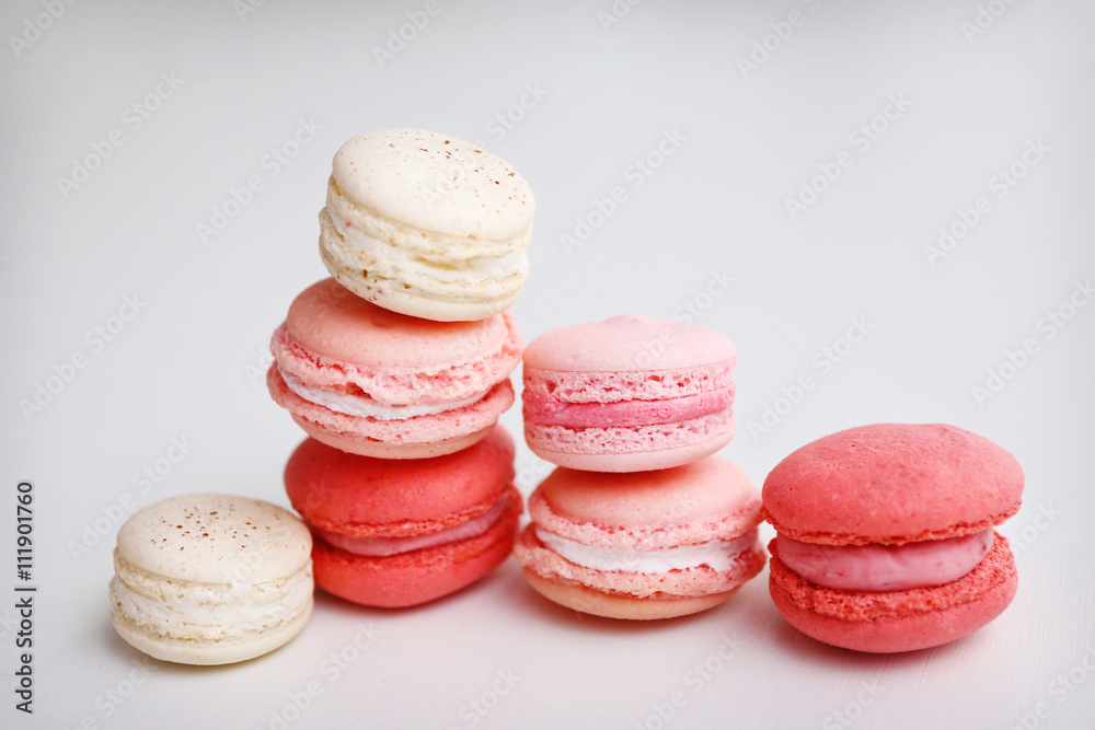 Fresh macaroons on white background, closeup Fresh macaroons on white background, closeup