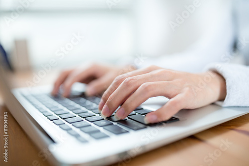 Female hands on the keyboard