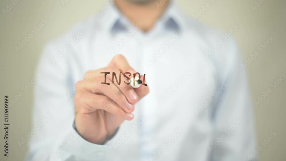 Inspire People , man writing on transparent wall Inspire People , man writing on transparent wall