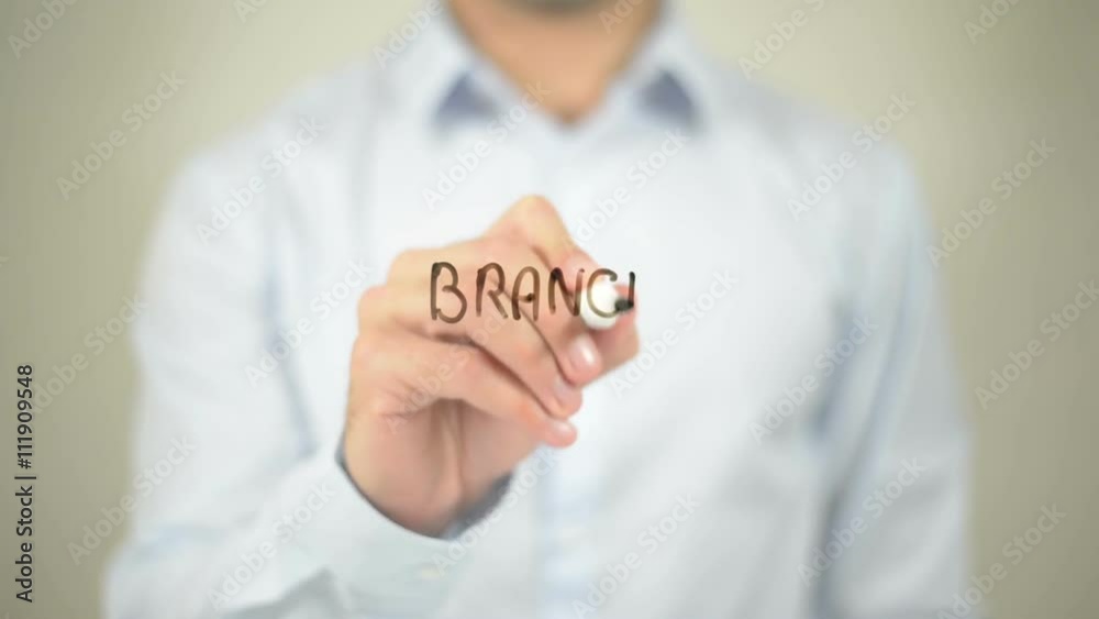 Branch Office , man writing on transparent wall Branch Office , man writing on transparent wall