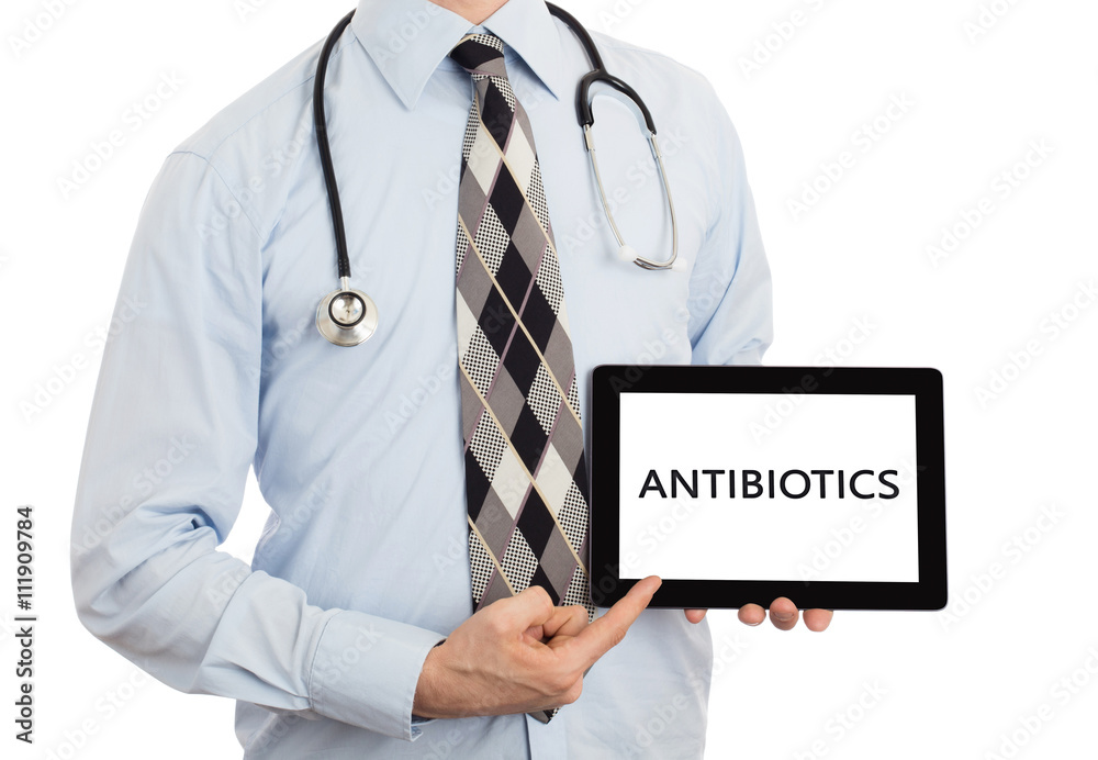 Doctor holding tablet - Antibiotics Doctor holding tablet - Antibiotics