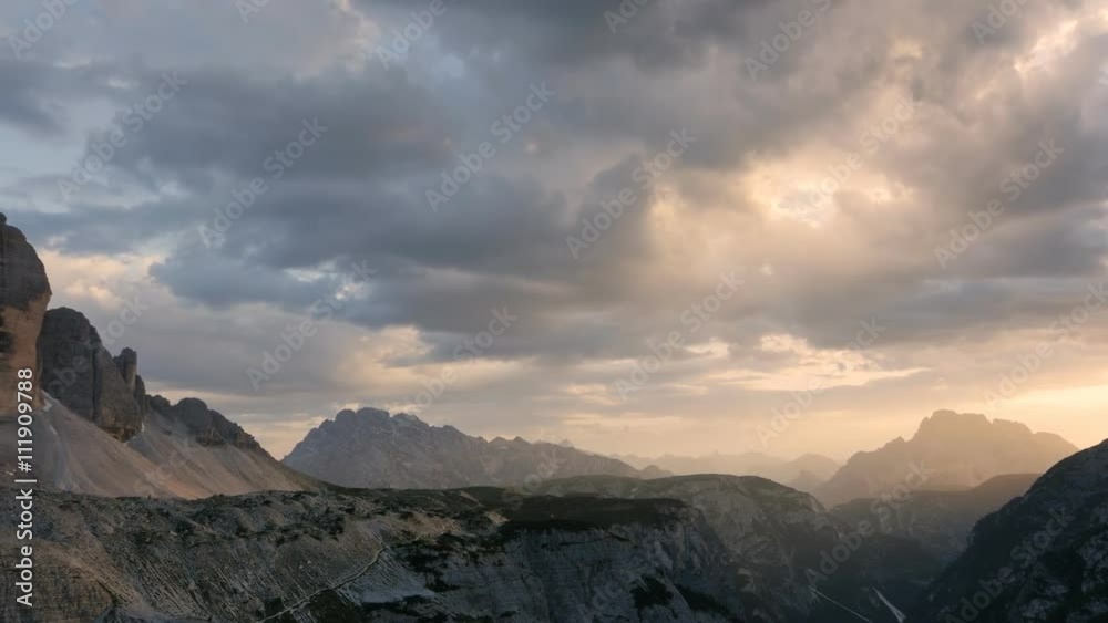tre cime di lavaredo peaks panning at the sunset warm colors tre cime di lavaredo peaks panning at the sunset warm colors