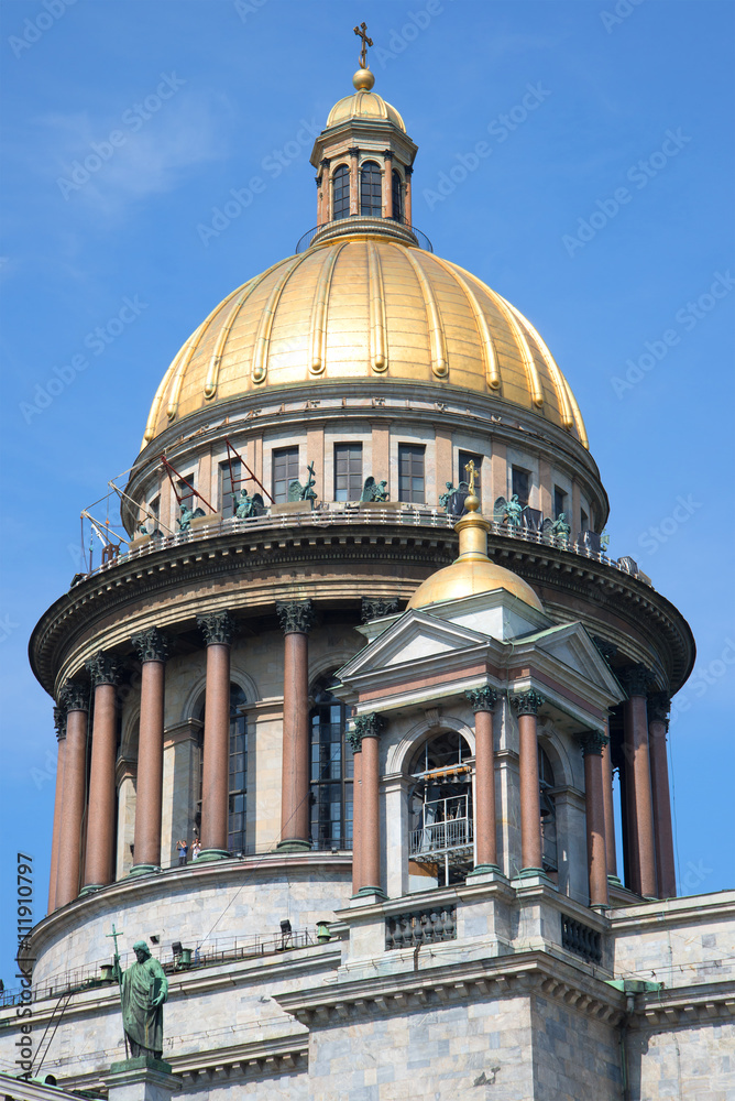 The dome of Isaac's Cathedral against the blue july sky. Saint Petersburg, Russia