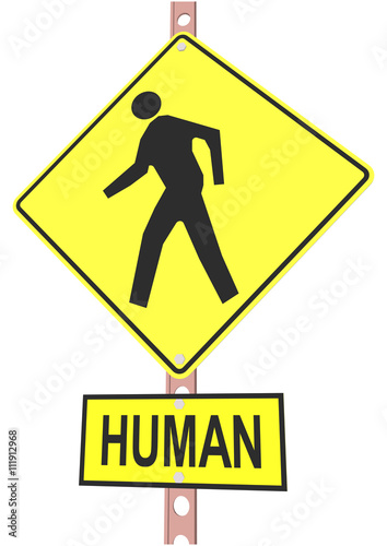 road sign and a sign with the text "HUMAN"