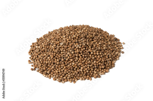 Isolated pile of dried coriander seed on a white background