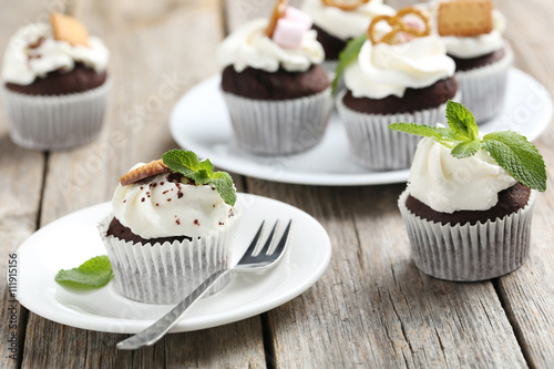 Chocolate cupcakes on a grey wooden table