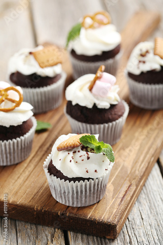 Chocolate cupcakes on a grey wooden table