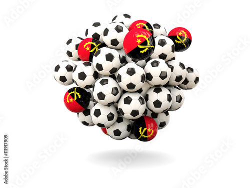 Pile of footballs with flag of angola