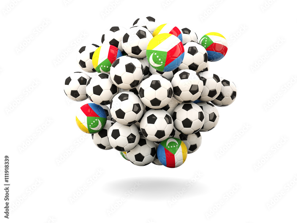 Pile of footballs with flag of comoros