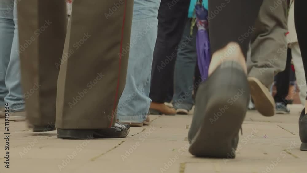 Anonymous crowd goes from the camera