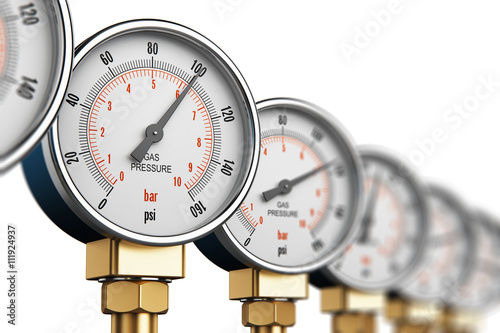 Row of industrial high pressure gas gauge meters photo