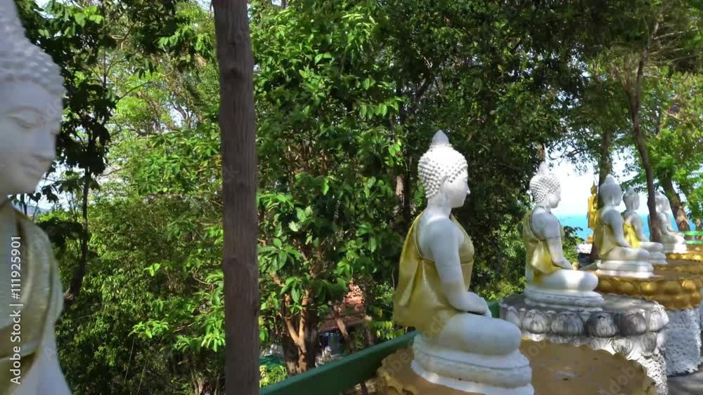 Walking along Buddha statues first face Walking along Buddha statues first face