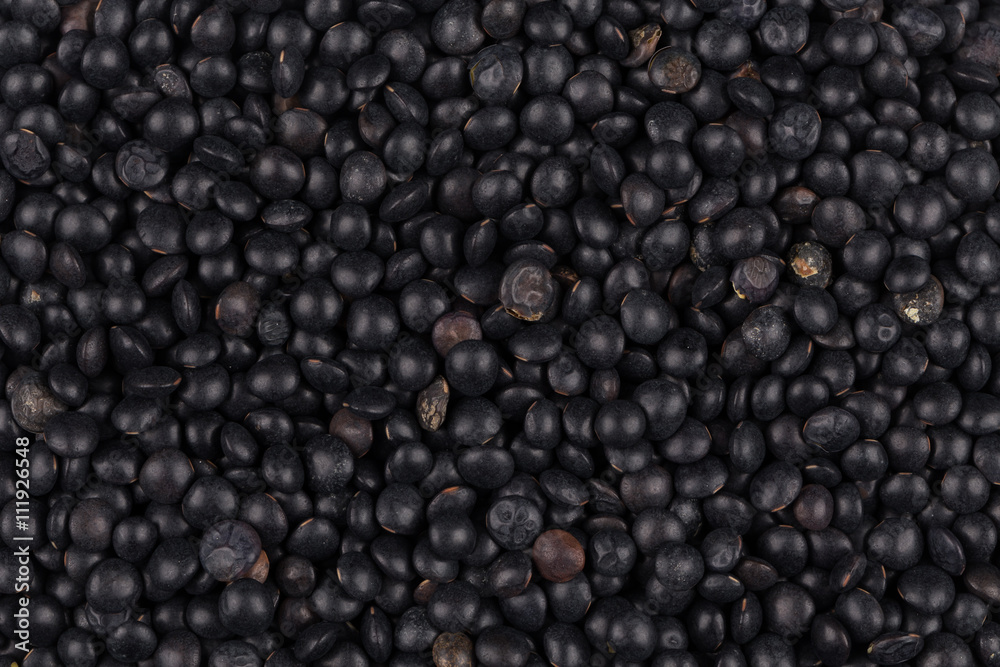black lentils background closeup black lentils background closeup
