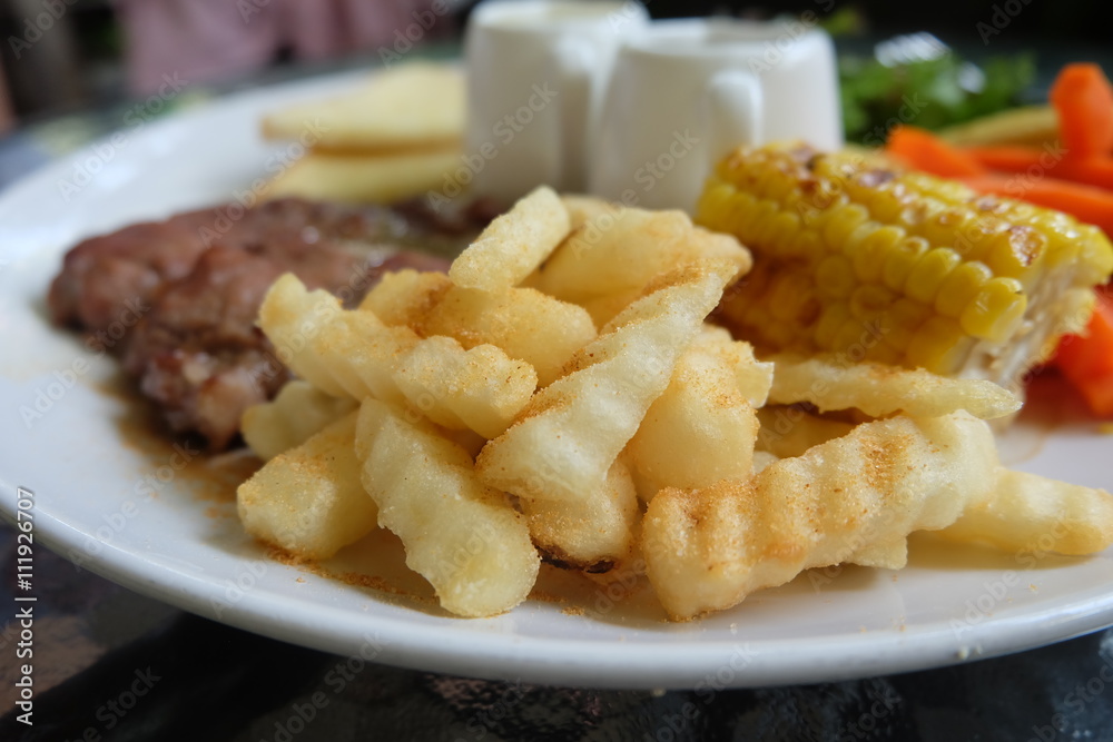 Grilled steak, French fries, bread and vegetables set
Grilled steak, French fries, bread and vegetables set