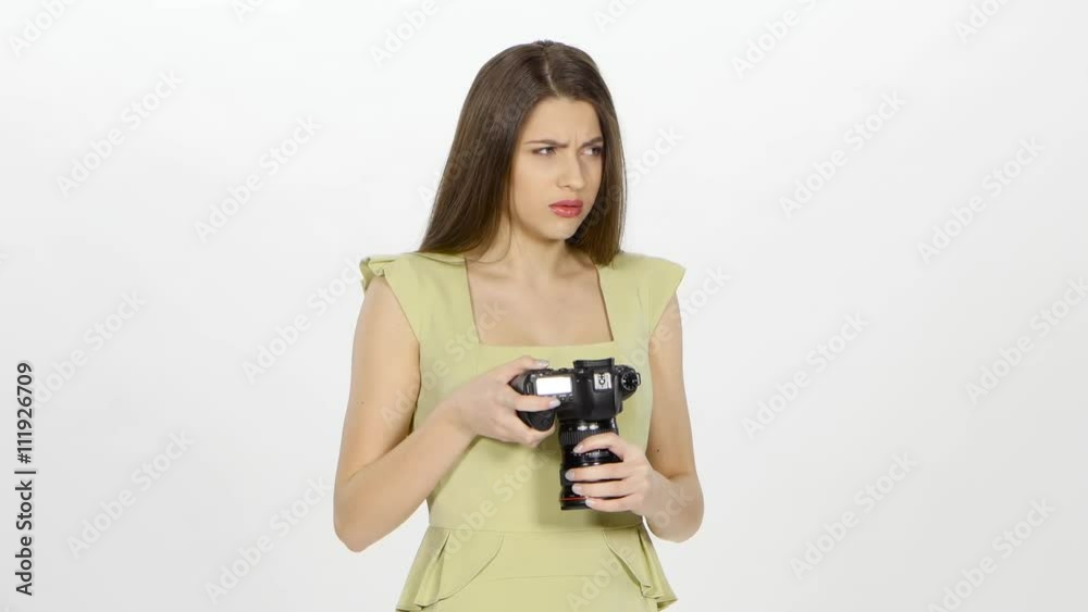 Model views at camera on results of photoshoot. White Model views at camera on results of photoshoot. White