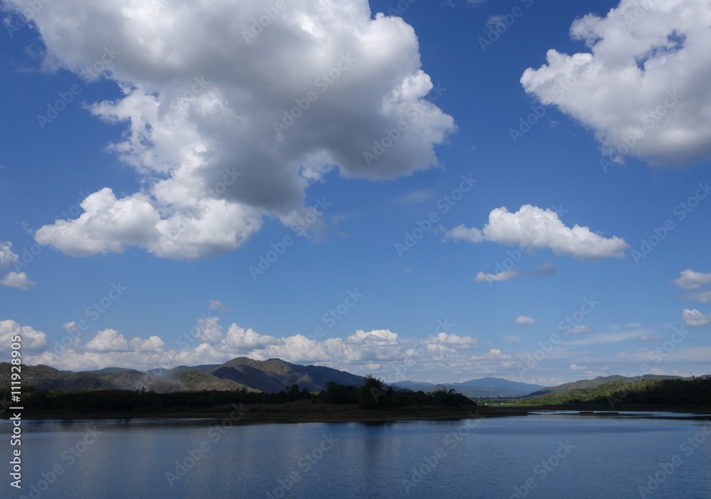Scenic view of small reservoir with blue sky background in Sukhothai province, Thailand