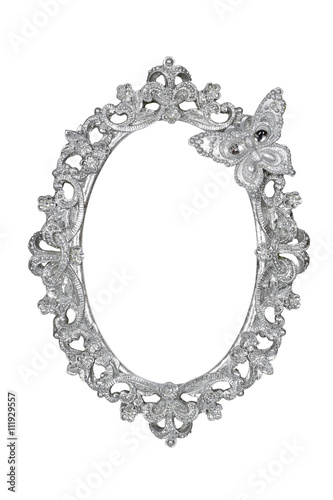 Oval silver picture frame with butterfly isolated with clipping path.