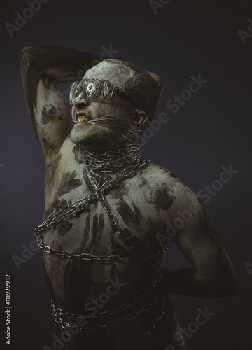 striper, bdsm, man with chains by the body and wire glasses, ski