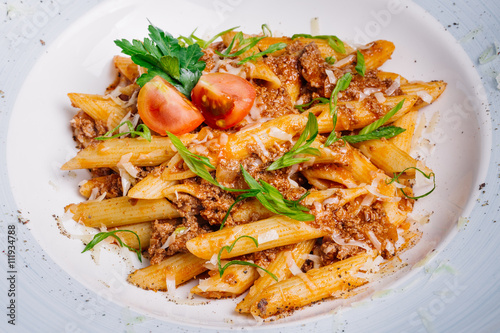 pasta nautically with minced meat on wood table