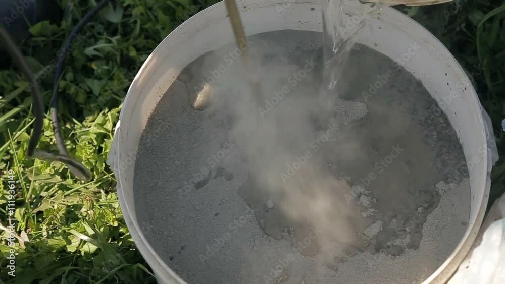 mixing cement in a bucket