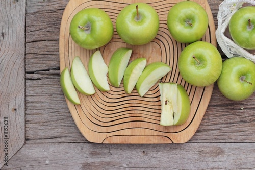 green apples is delicious on wood background.