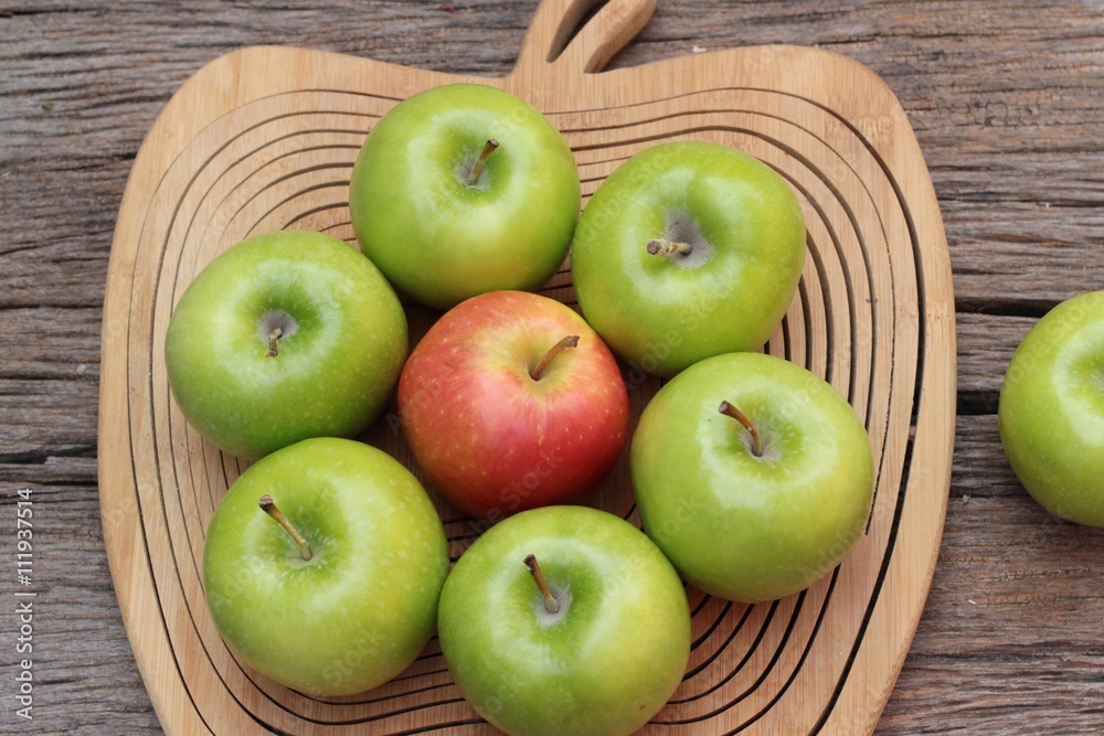 green and red apples on wood background. green and red apples on wood background.