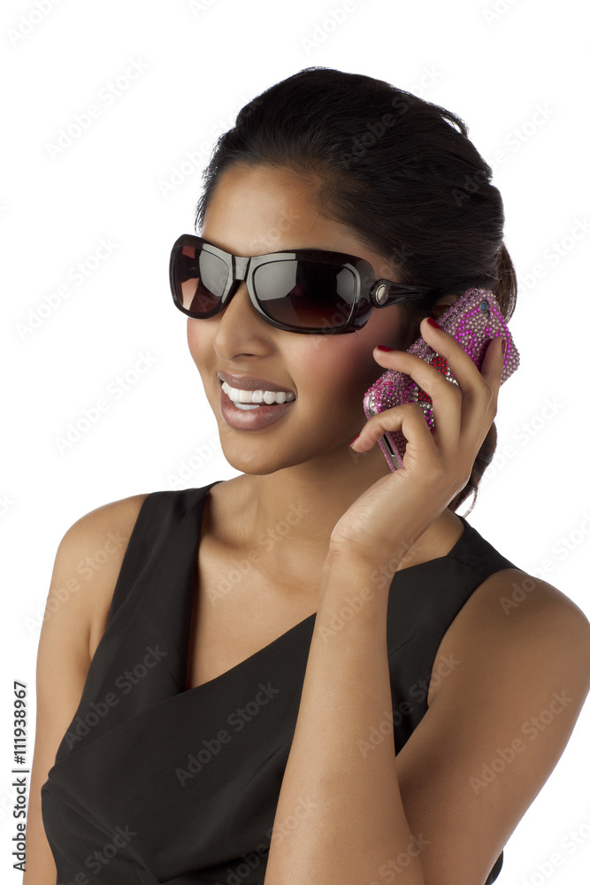 smiling woman talking on the cellular phone smiling woman talking on the cellular phone