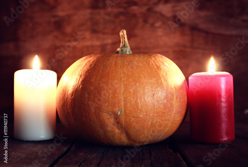 thanksgivings day pumpkin and candles
