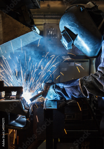Industrial steel worker speeds motion in factory