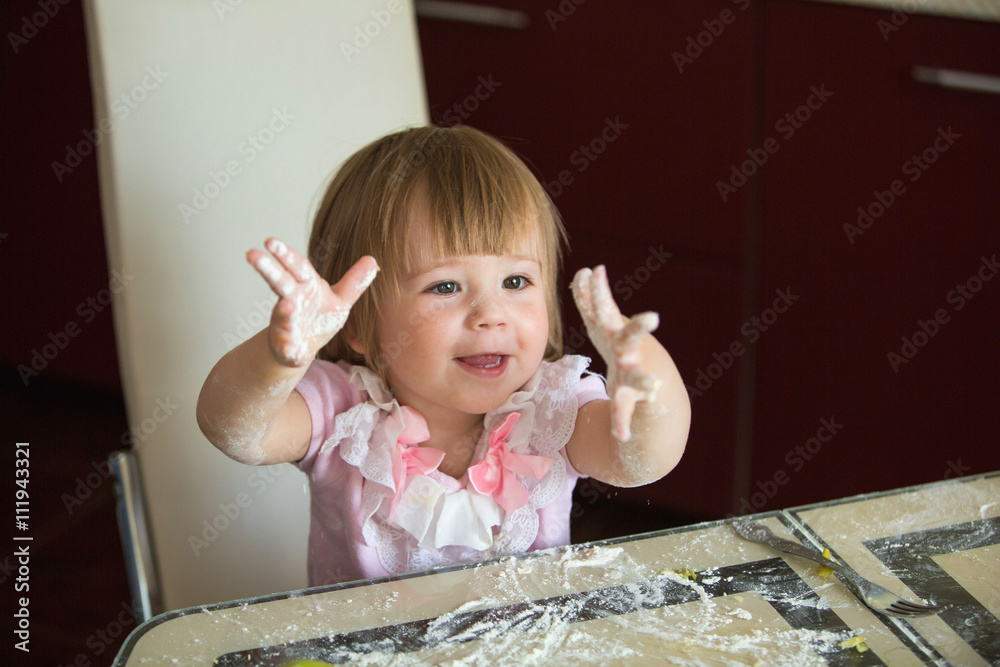 Child hands mixing flour in the kitchen, child 2 years, healthy eating home cooking Child hands mixing flour in the kitchen, child 2 years, healthy eating home cooking