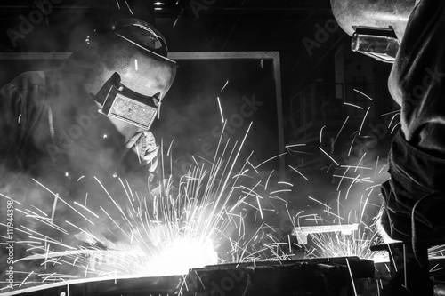 Industrial steel welder in factory, black&White