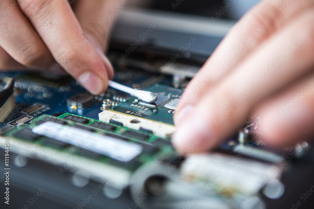 Computer literacy repair men hands, cooling the hot temperature of the laptop Computer literacy repair men hands, cooling the hot temperature of the laptop