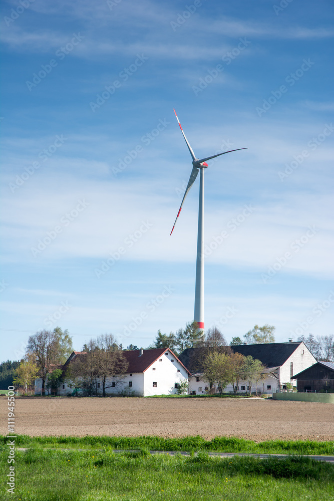 Fototapeta premium Windmill and agricultural buildings