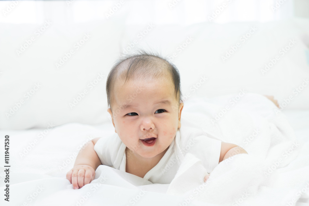 Portrait of a newborn Asian baby on the bed Portrait of a newborn Asian baby on the bed