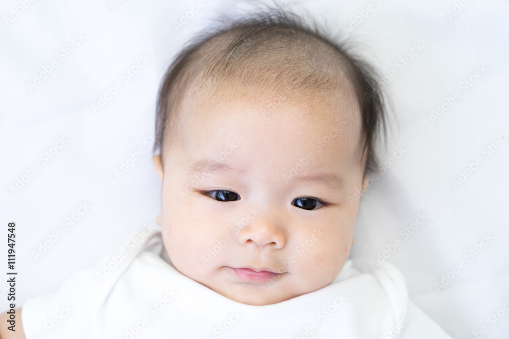 Portrait of a newborn Asian baby on the bed Portrait of a newborn Asian baby on the bed