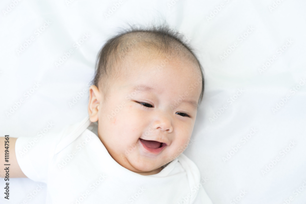 Portrait of a newborn Asian baby on the bed Portrait of a newborn Asian baby on the bed