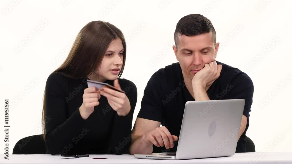 Girl and a boy doing online shopping. White Girl and a boy doing online shopping. White