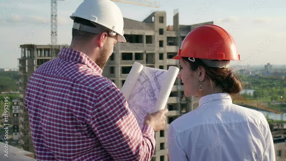 Architect and engineer discuss the project Architect and engineer discuss the project