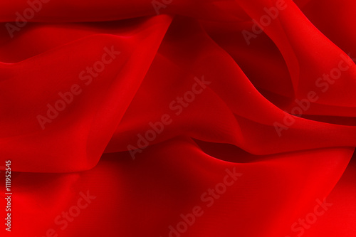 delicate Red silky fabric folds background texture