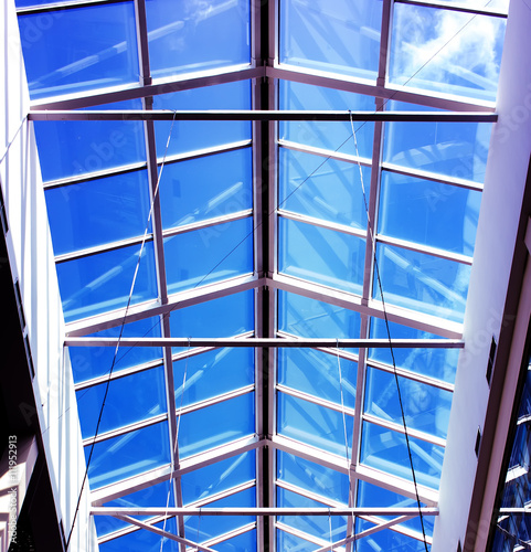 glass roof shopping center with blue sky in summer