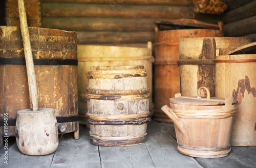 Storage racks with old wooden barrels.