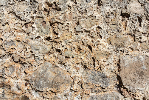 Ancient roughness stone wall.  Beige  texture. Can be used as background © Masterovoy