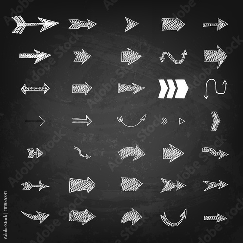 Set of hand drawn arrows on black chalkboard background. Design