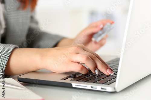 Close up view of businesswoman hands holding credit card