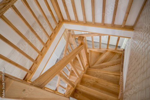 Modern interior. A wooden staircase in the interior of the house