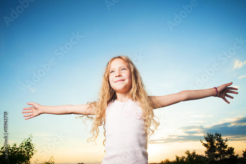 Child with arms outstretched