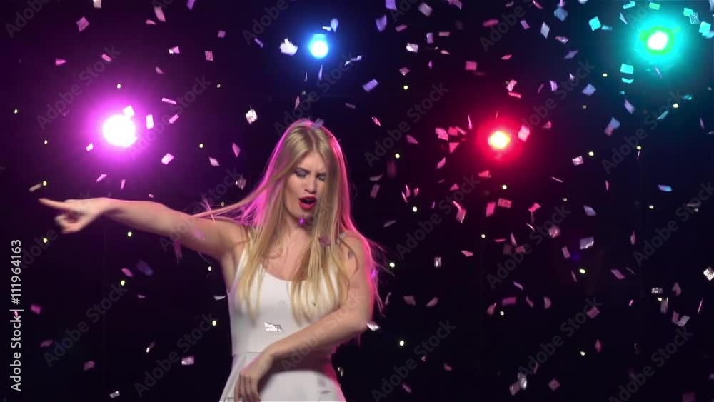 Happy girl are funny dancing against disco lights. Slow motion Happy girl are funny dancing against disco lights. Slow motion
